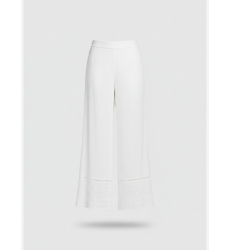 White two-piece set: square-neck top with tie straps and wide-leg pants, intricate embroidery, lightweight fabric.