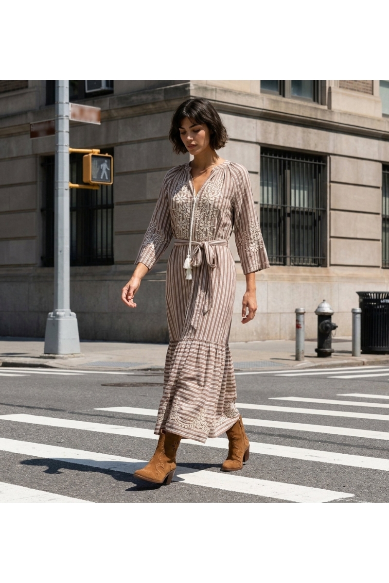 Elegant long maxi dress worn by a model in a vibrant city park setting, perfect for summer events.