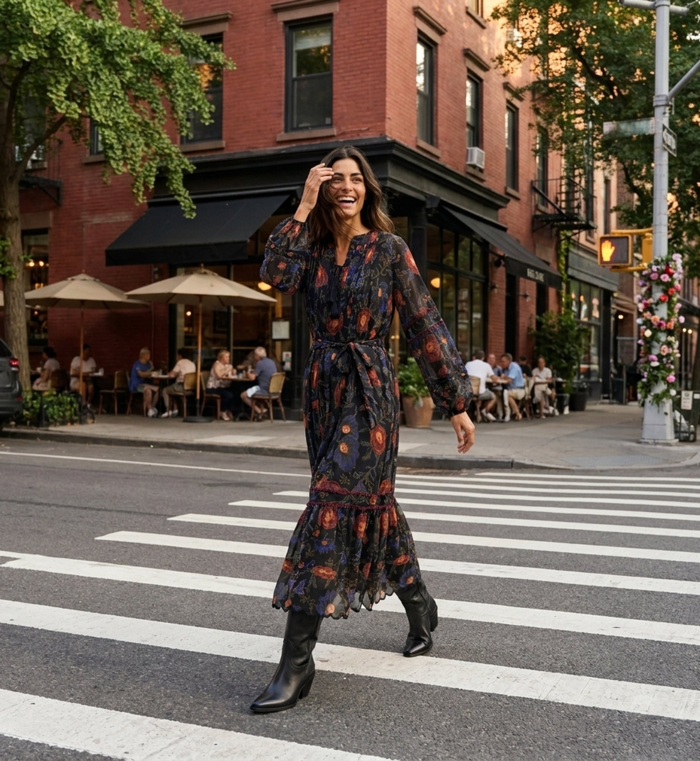 Black long-sleeve midi dress with red and blue floral print, tiered skirt, tie-waist, sheer fabric, street style view.