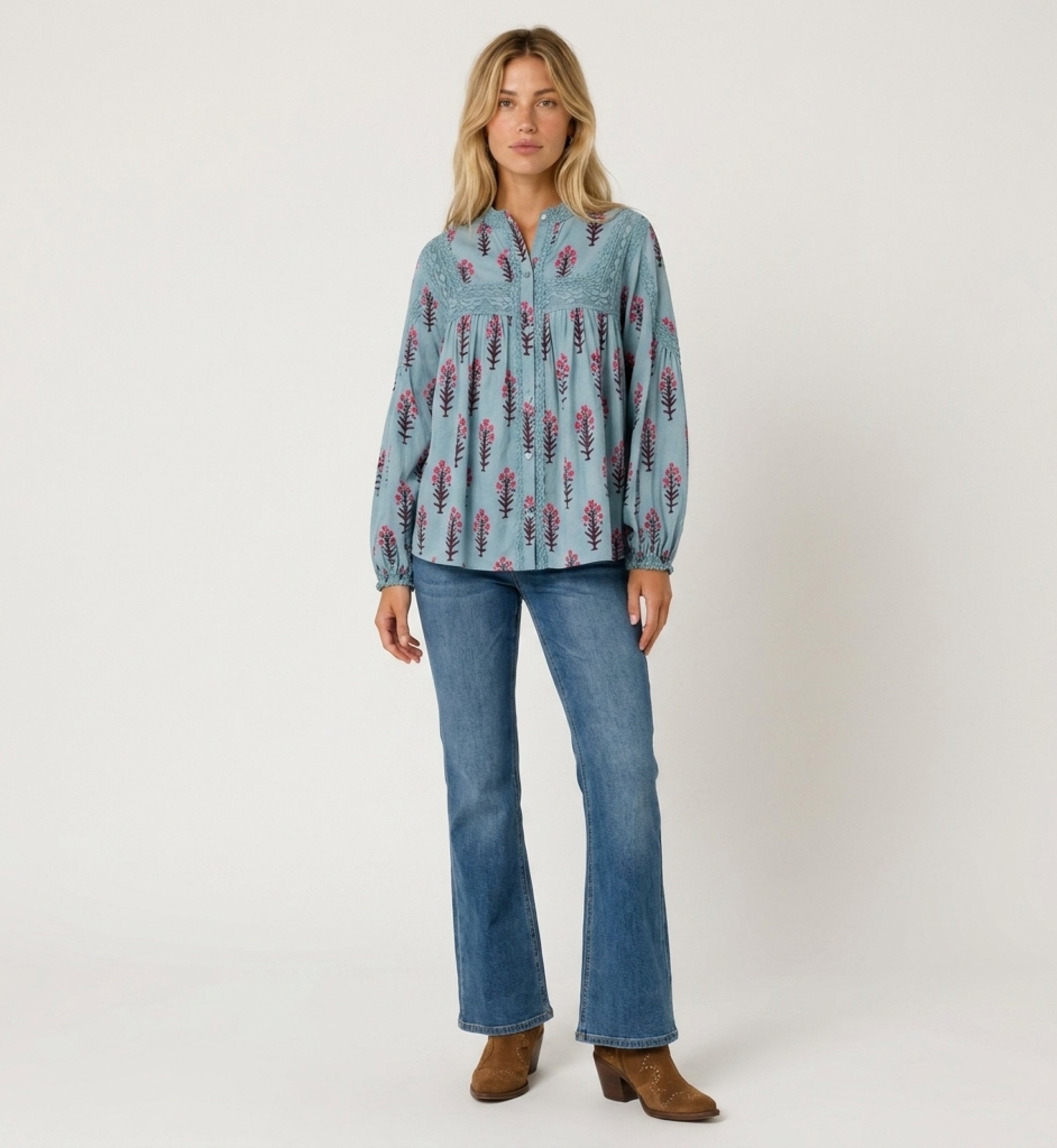 Light blue long-sleeve peasant blouse with pink and brown floral pattern, lace trim, relaxed fit, cotton fabric, front view.