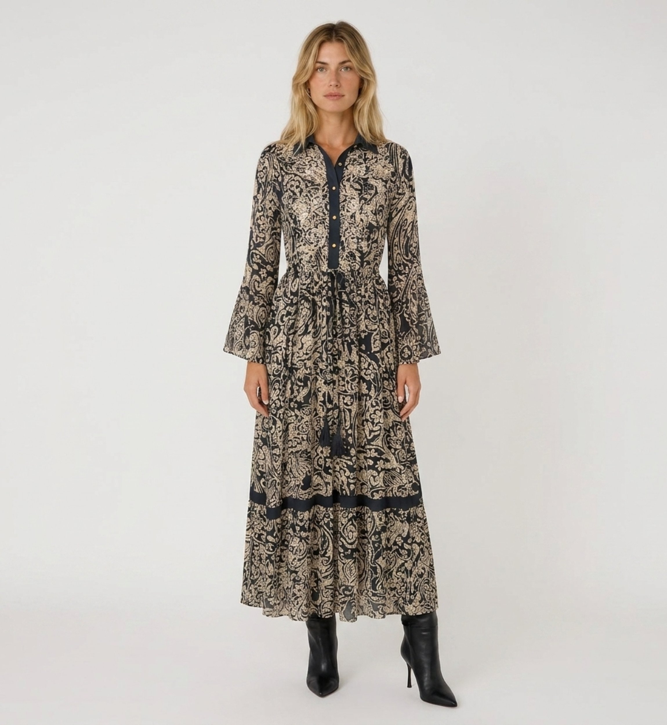 Front view: black and beige patterned maxi dress, collared, button-front, bell sleeves, drawstring waist.