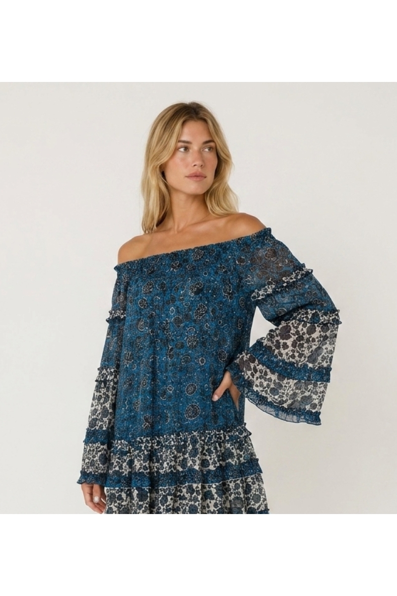 Blue and white off-shoulder mini dress with long sleeves, tiered ruffles, and sheer floral fabric.