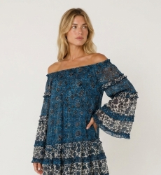 Blue and white off-shoulder mini dress with long sleeves, tiered ruffles, and sheer floral fabric.