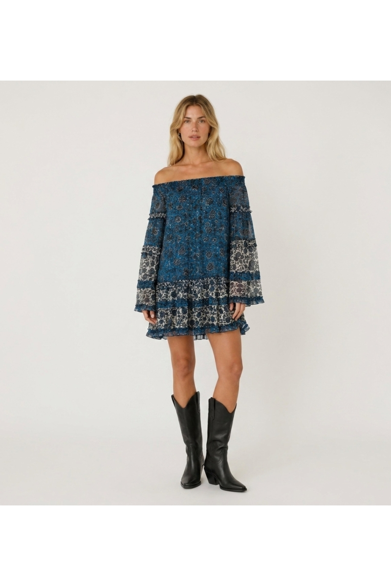 Front view of a blue and white off-the-shoulder mini dress with long sleeves, tiered ruffles, and sheer floral print.