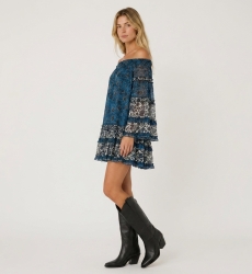 Blue and white off-shoulder mini dress with long sleeves, tiered ruffles, sheer floral fabric, three-quarter view.
