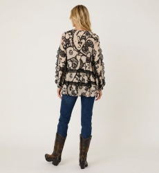 Blusa leggera fantasia beige e nera, maniche lunghe, vestibilità ampia con ruches e nappine, vista dietro.