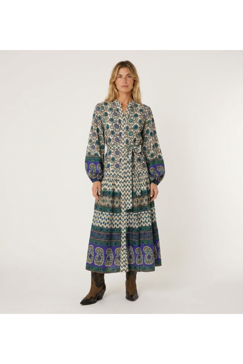 Abito midi maniche lunghe crema, blu, verde, fantasie geometriche e floreali, vita annodata, gonna a balze, vista frontale.