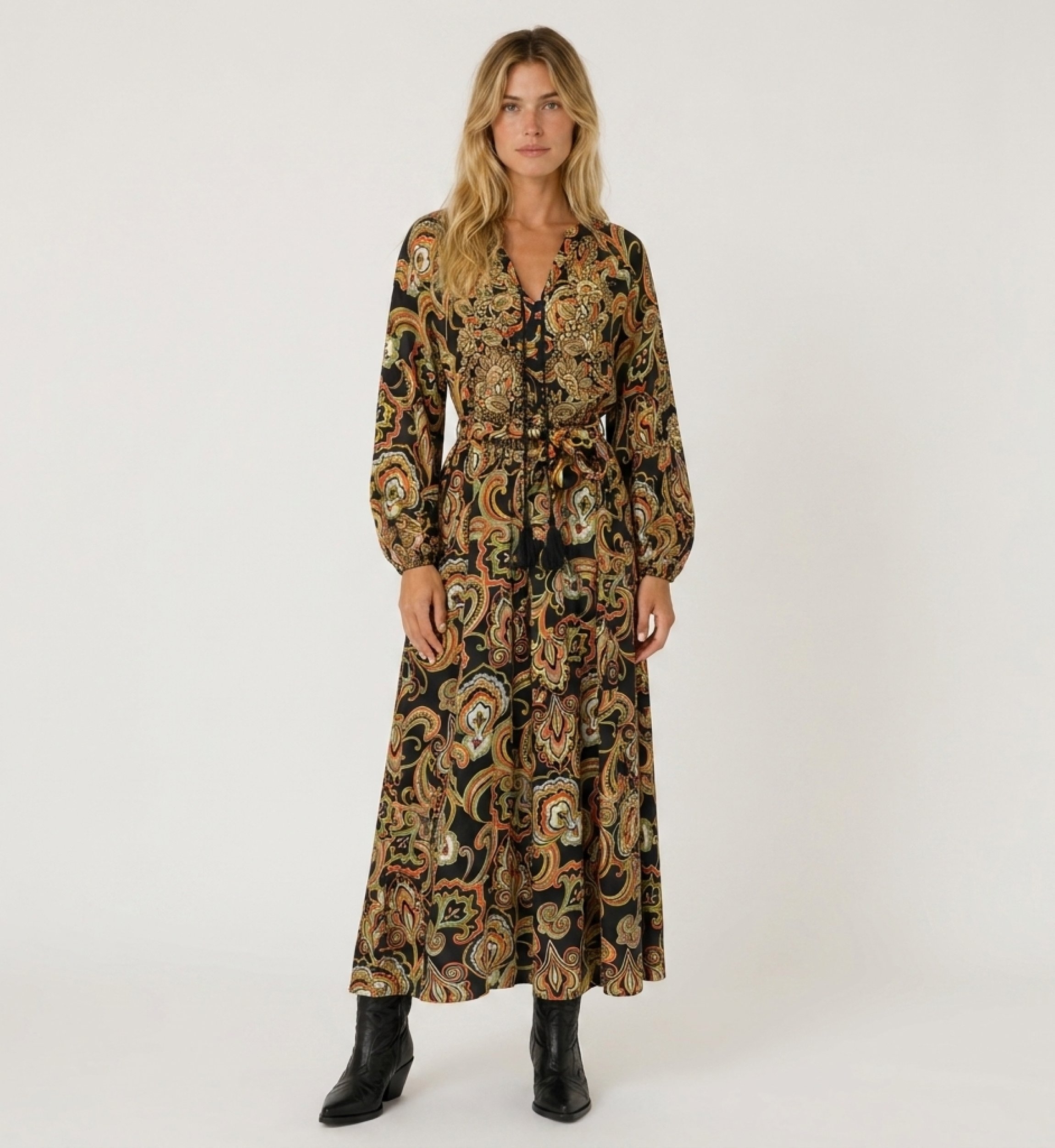 Front view of a black long-sleeve V-neck maxi dress with colorful paisley pattern, tie-waist, and flowing fabric.