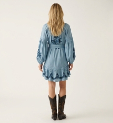 Black mini dress, loose fit, long balloon sleeves, tiered skirt with white floral embroidery, tie-waist, back view.