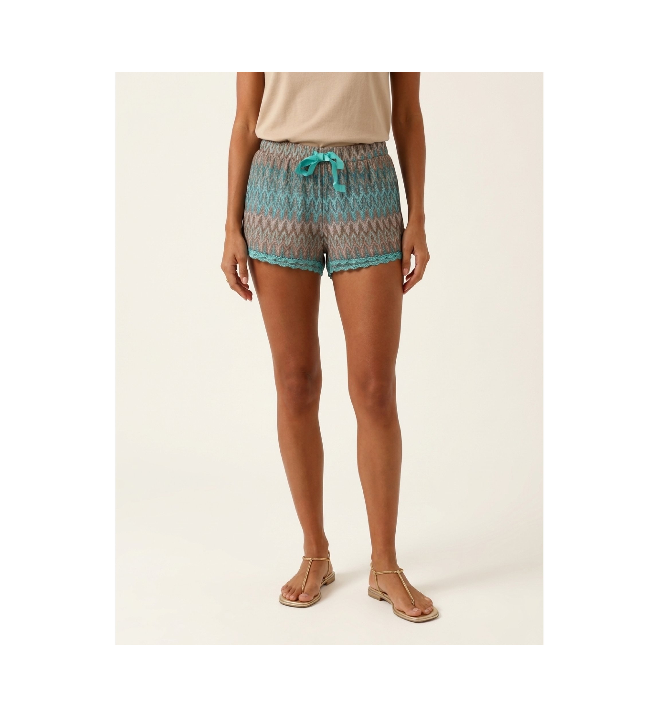 Close-up of women's casual shorts on a model, highlighting comfortable fit and fabric detail on a light background.